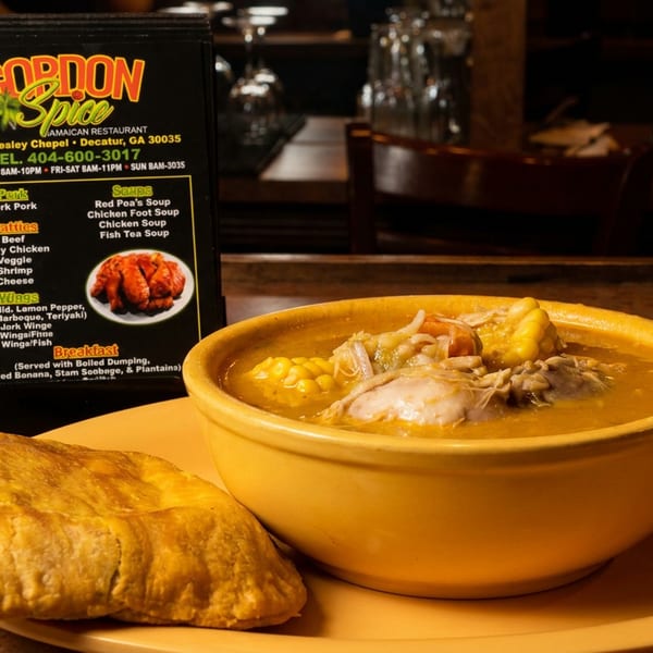 Gordon Spice Jamaican Restaurant menu with a bowl of soup and a patty on a yellow plate.